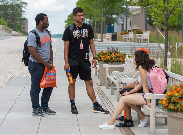 Summer Start students talking on campus.